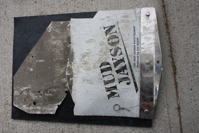 original flap laid over new plain black flap.