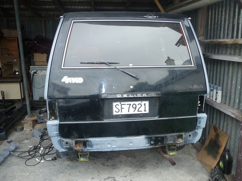 paint and decal to be removed and panels straightened,door handle to be shaved and may relocate number plate.