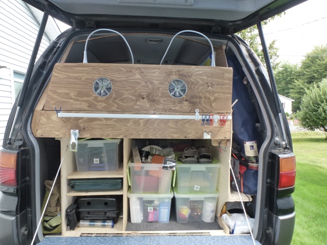 the folding headboard with fans and IKEA lights connected to solar system (15W panel, 30A charge controler, 2000W inverter and 100Ah deep cycle lead battery)