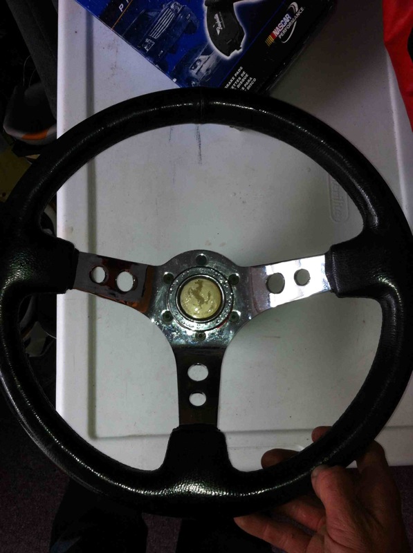 nice 13.5'' steering wheel with knock off ferrari horse horn. $50 obo
