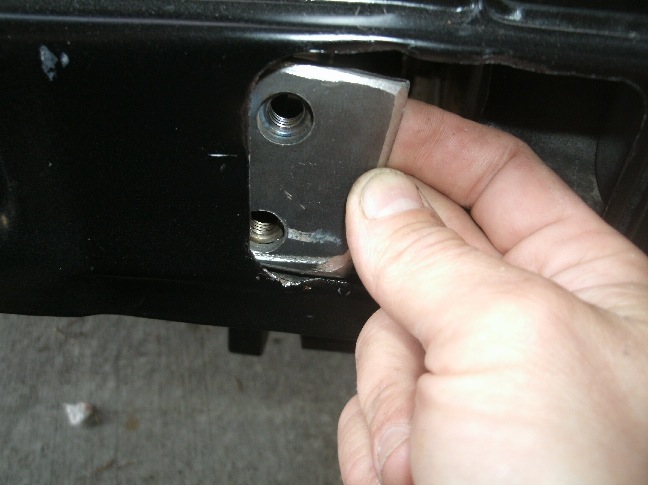 3/16 steel plates with nuts tacked to back slip into the apron holes to allow the bumper to be anchored securely to the rear van apron from the outside.  I used two  1/2&quot; machine head Grade 8 fasteners per side.  The pic was taken before the holes were drilled for the plates.