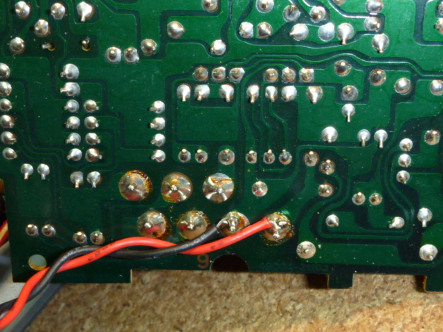 Delica's thermometer circuit board, the other side, with voltmeter's sense wires attached.