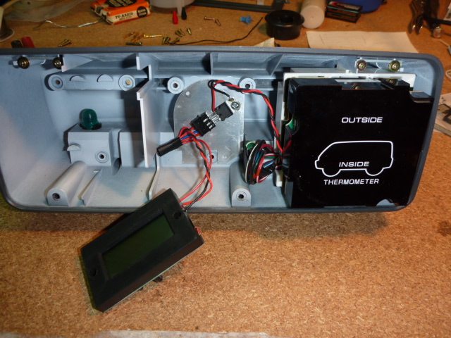 The thermometer reinstalled, with the voltmeter plugged into the 3-tab regulator.