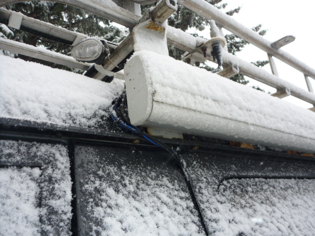 The blue wires for the lights, the black RG-174 antenna wires come out of the front of the sliding door and go up around the awning and up the roof rack's mounting foot. The small light is 1/2 of the left front ditch light. The other 1/2 is more obvious, and is labelled, in the photo of the front of the rack. The 4x4 floods are LED, but the wiring is 16 gauge, enough to switch to halogen or higher powered LED as needed without re-wiring. Oh, and there is another RG-58 antenna coax in this bundle that goes to the stud mount above the awning. It is used for either a CB or ham co-linear antenna.