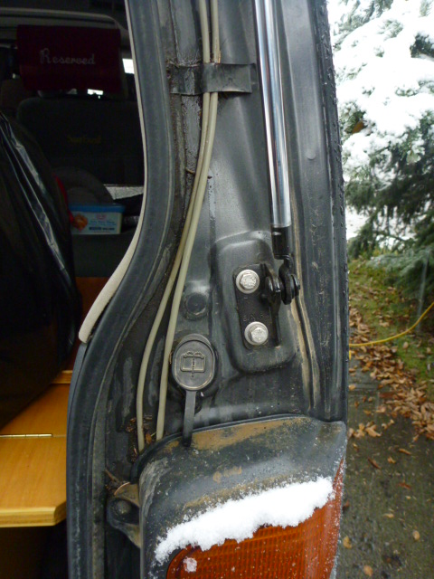Rear tailgate, top of tail light and w/w fluid fill cap.