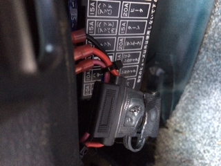 The melted rubber thing closed. It's located next to the fuse box under the steering column...