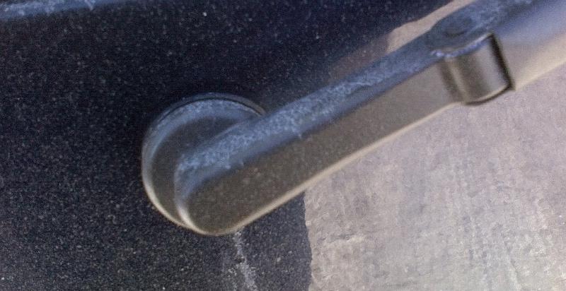 Wiper arm with cover on.