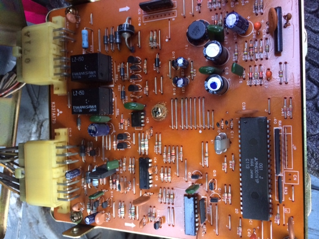 circuit board (two capacitors look to be a bit leaky? middle small black one, and mid-right round black one)