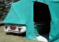 A 1962 Nomad tent trailer/boat... The bottom of it is a tent trailer... And to add multi-tasking to the package, there is a small boat that fits on top of the trailer... The boat can handle a small outboard engine... And to make it even more interesting, apparently the tent trailer itself can float on water, so that you can tow the trailer with the boat (on a lake)<br /><br />On the back the manufacturer's name (and I assume designer) is &quot;Imagineering Associates Limited, Kitchener, Ontario (Canada)&quot;