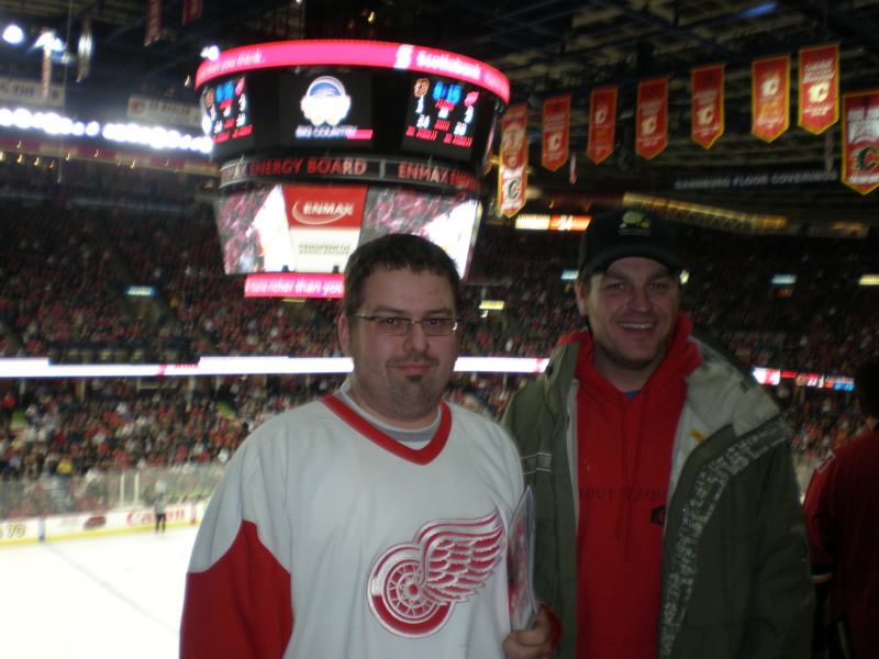 Brian wearing a Detroit jersey in Cowtown while Detroit lays the smack down.