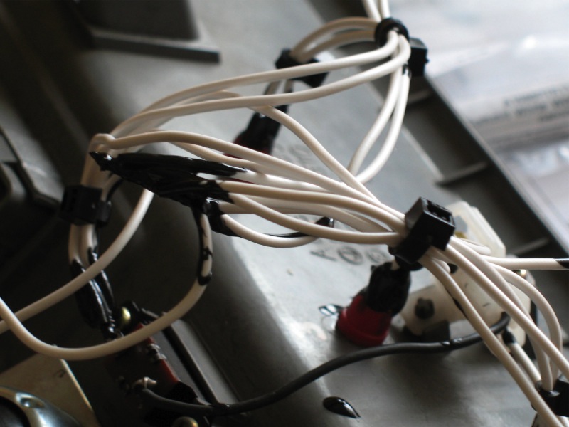 Close-up of liquid electrical taping. Yes, it is kinda messy stuff. One has to use it sparingly, work quickly, and wait between layers.