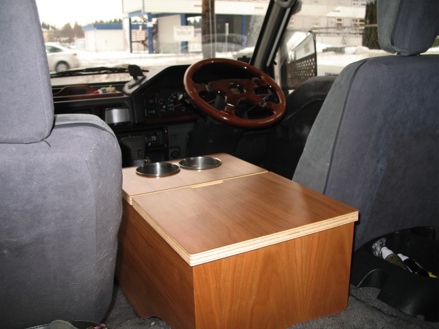 Rear compartment accessed through rear lid. Thought about changing around the opening of the lid from front-to-back to right-to-left (for the driver and for the rear passengers so they don't have to reach over the opened lid).