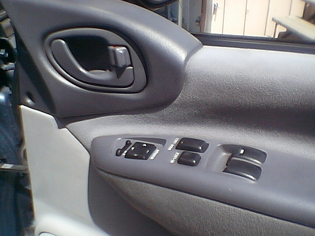 drivers door panel. power windows, mirrors, and locks.