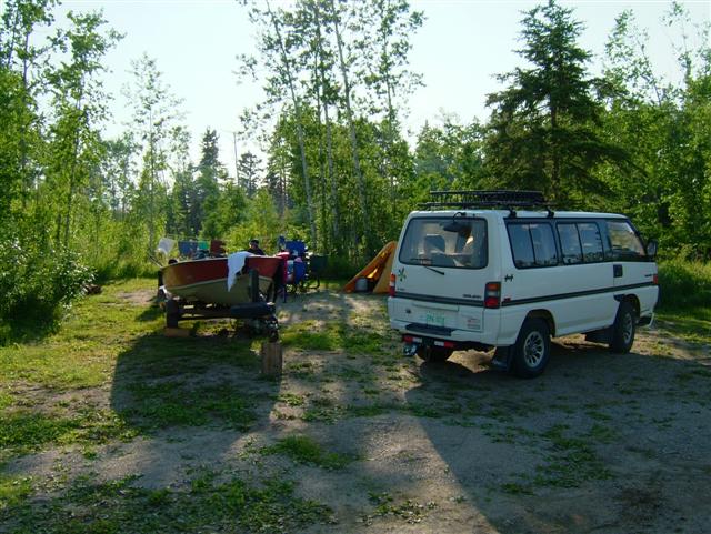 pic of campsite with the small boat. Wish I had a cover for the boat.