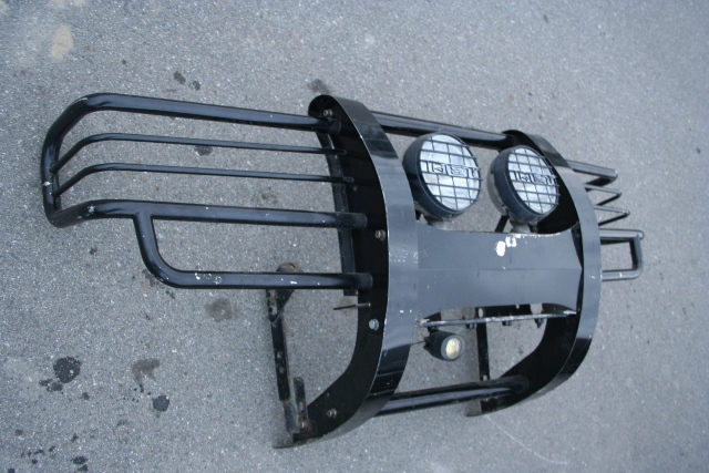SOLD<br /><br />Front Bumper and Lights<br /><br />I'll include the lights that are on it, though there's no guarantee they work. <br /><br />I planned to gravel guard it.  It's in good shape but not perfect.  I think smooth and shiny surfaces on the exterior of a vehicle is somewhat ridiculous...though I love chrome as much as any one else, it should be used as trim.  Gravel guard is textured so it covers up flaws instead of highlighting them.  It can easily be repaired with a simple respray as it blends well, a $10 can will last a decade for touch-ups.  And it absorbs some of the energy when things like rocks hit it, lessening the impact.  All good things that paint or chrome can't really do, I think the stuff should be on everything:)<br /><br />I'm not sure how the bumper went on, or what should have been included.  It looks as though there's the major brackets and maybe one side is different than the other?  I can't see it being too difficult for any decent fabricator to mount up.<br /><br />$400