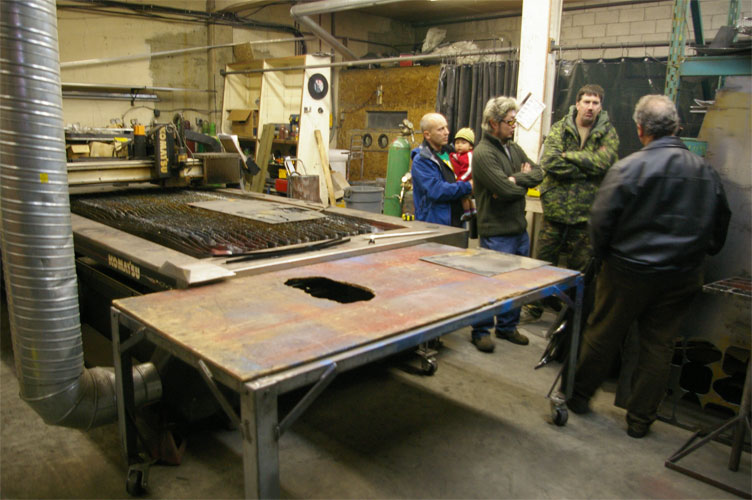 Shawn, the gaffer at Syncro is explaining the benefits of a plasma cutter to Jay (TardisDeli), Sasquatch Hunter &amp; DeliCat.