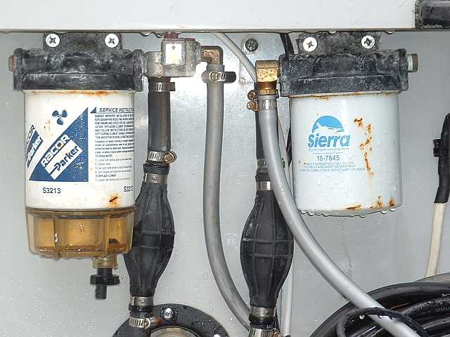 Racor fuel filter with metal screw top housing.