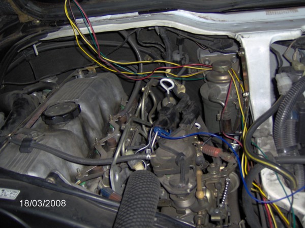 Wiring is better looking now, this was still the experimental stage getting everything working. (Don't want Green1 giving me grief over a sloppy install! ;-) Ran the lines around the engine compartment and to the servo and then on to the power supply.  You can also see in this picture the position of the servo cable.  Just sneaks past the fuel filter and makes a loop back and then up to the servo.