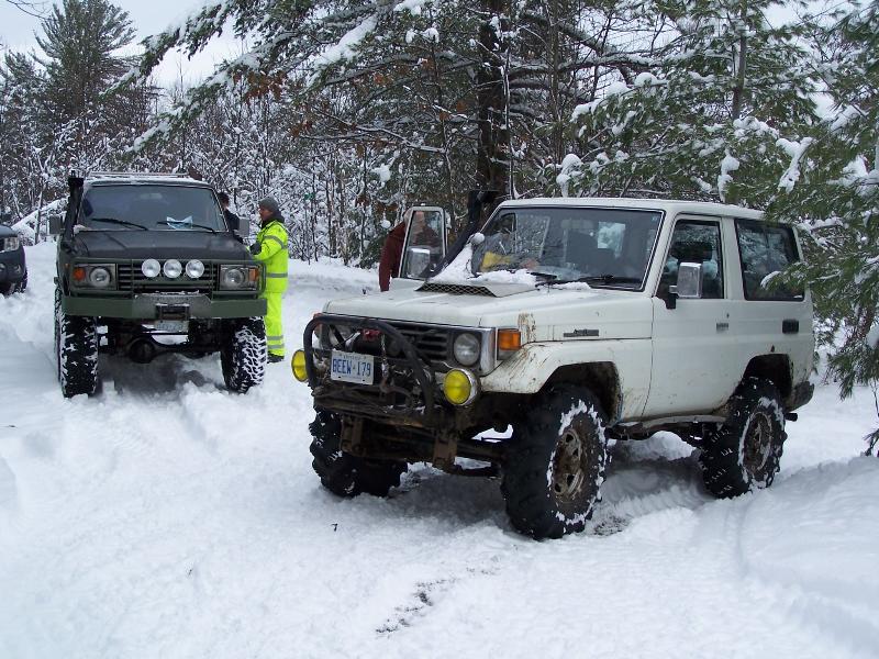 this is one of my past exploring trucks. the White PZJ70<br />the tractor tires can allow me to idle through almost anything. many times all you see is the crossbars in the soft dirt with NO spining.<br />locked in the rear diff to help when the trail is twisting.<br />the winch for when i do actually loose traction.<br />the snorkel for when i missjudge the depth of the puddle or encounter a man made tank trap on the trail.<br />it is an idle truck.