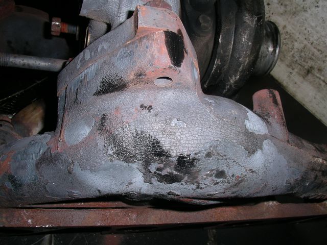 Discoloration of manifold due to extreme heating - note flaking of iron