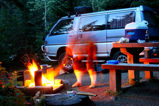 My wife Linda stoking the fire in Glacier National Park, BC.
