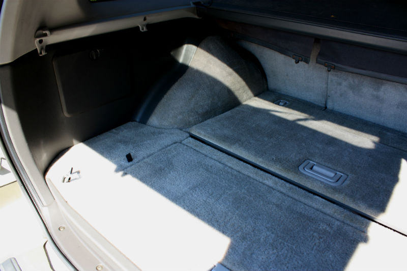 Trunk under floor compartment with panels in place.