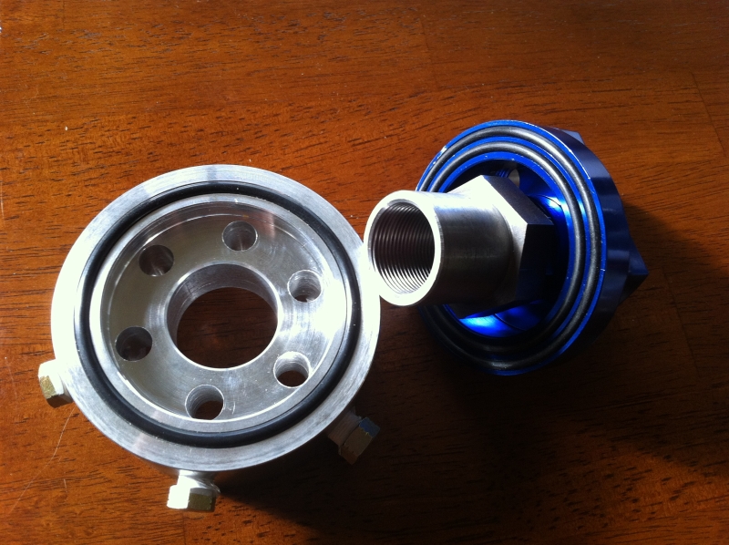 A view of the seals on each part. Note that for assembly purposes, the Aluminum engine part is upside down relative to the blue anodized oil filter relocation part.