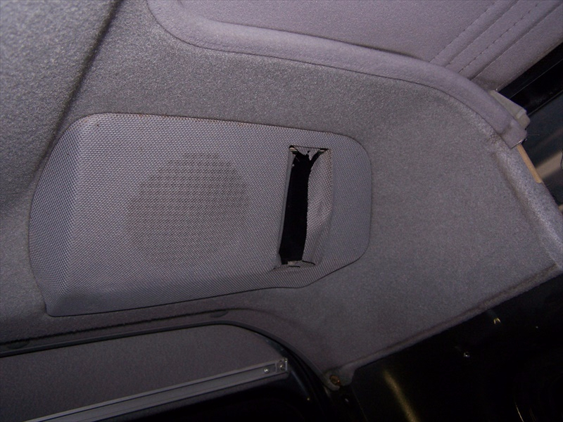 Rear speaker access cover removed