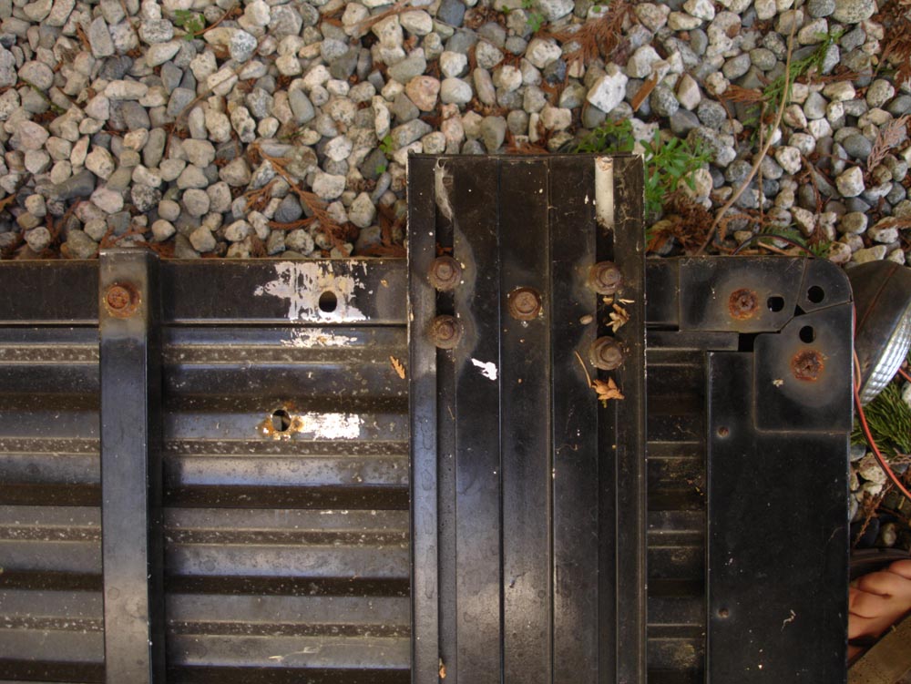 bottom corner close up of mounting holes